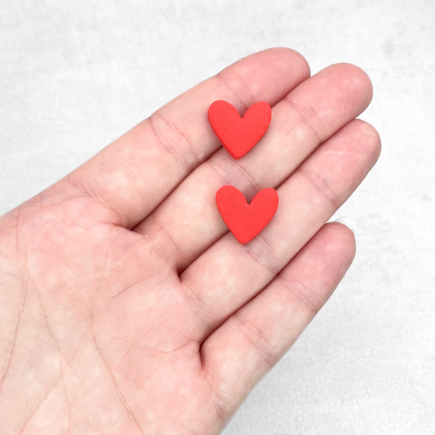 Red heart stud earrings. Handmade red polymer clay stud earrings.