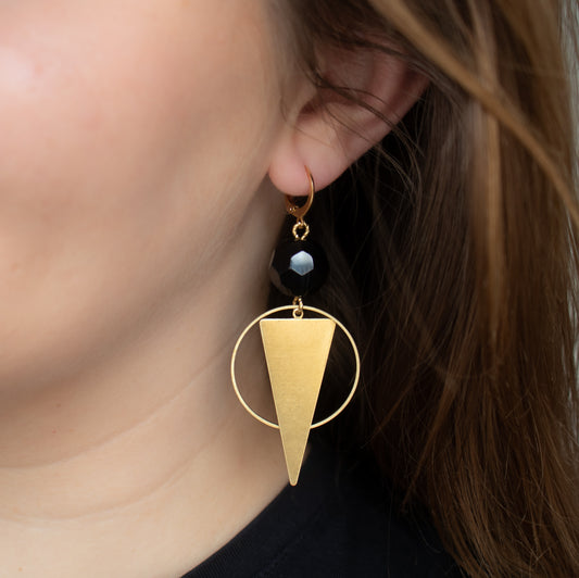 Black beads with gold charms. Handmade geometric earrings.