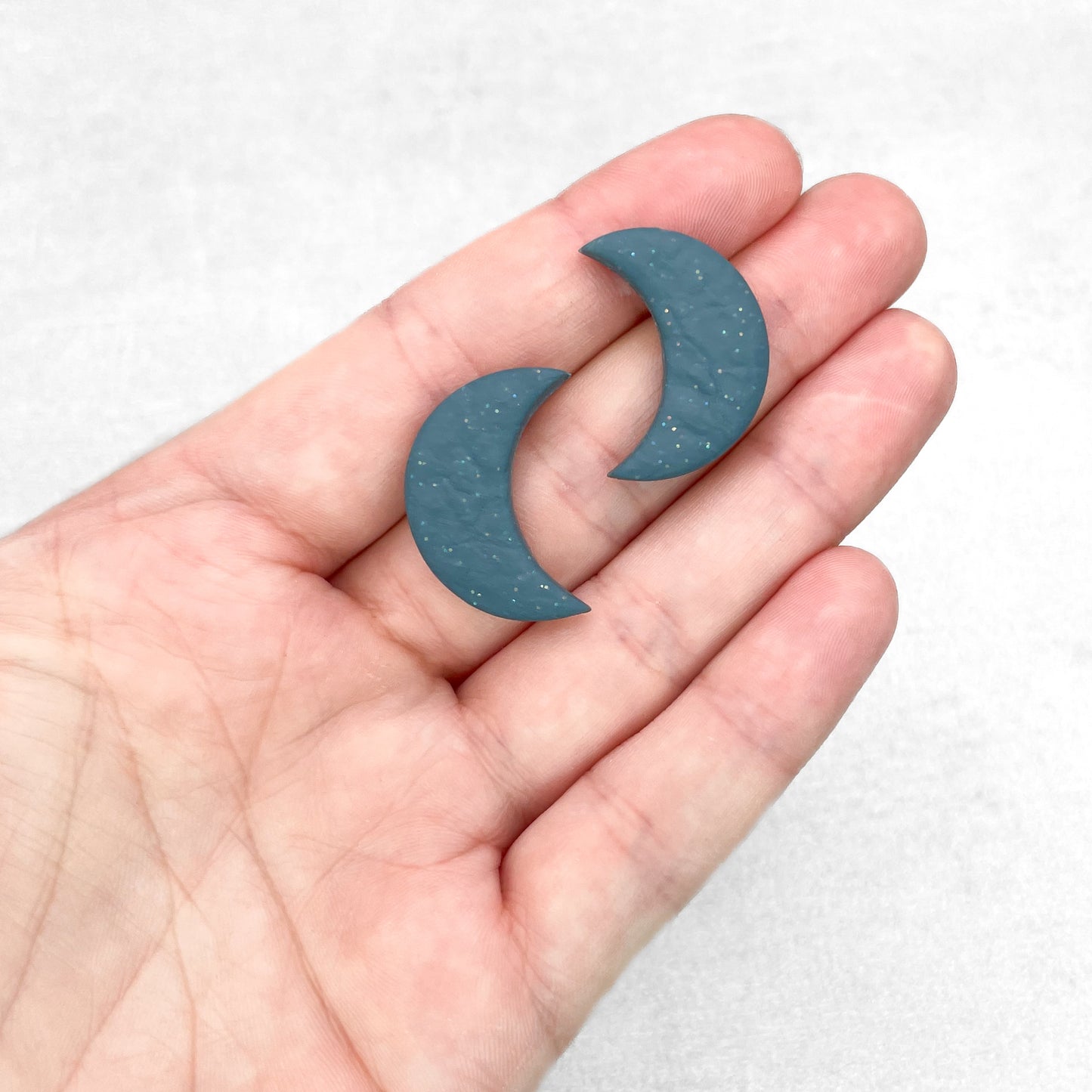 Moon polymer clay stud earrings. Steel blue with glitter handmade stud earrings.