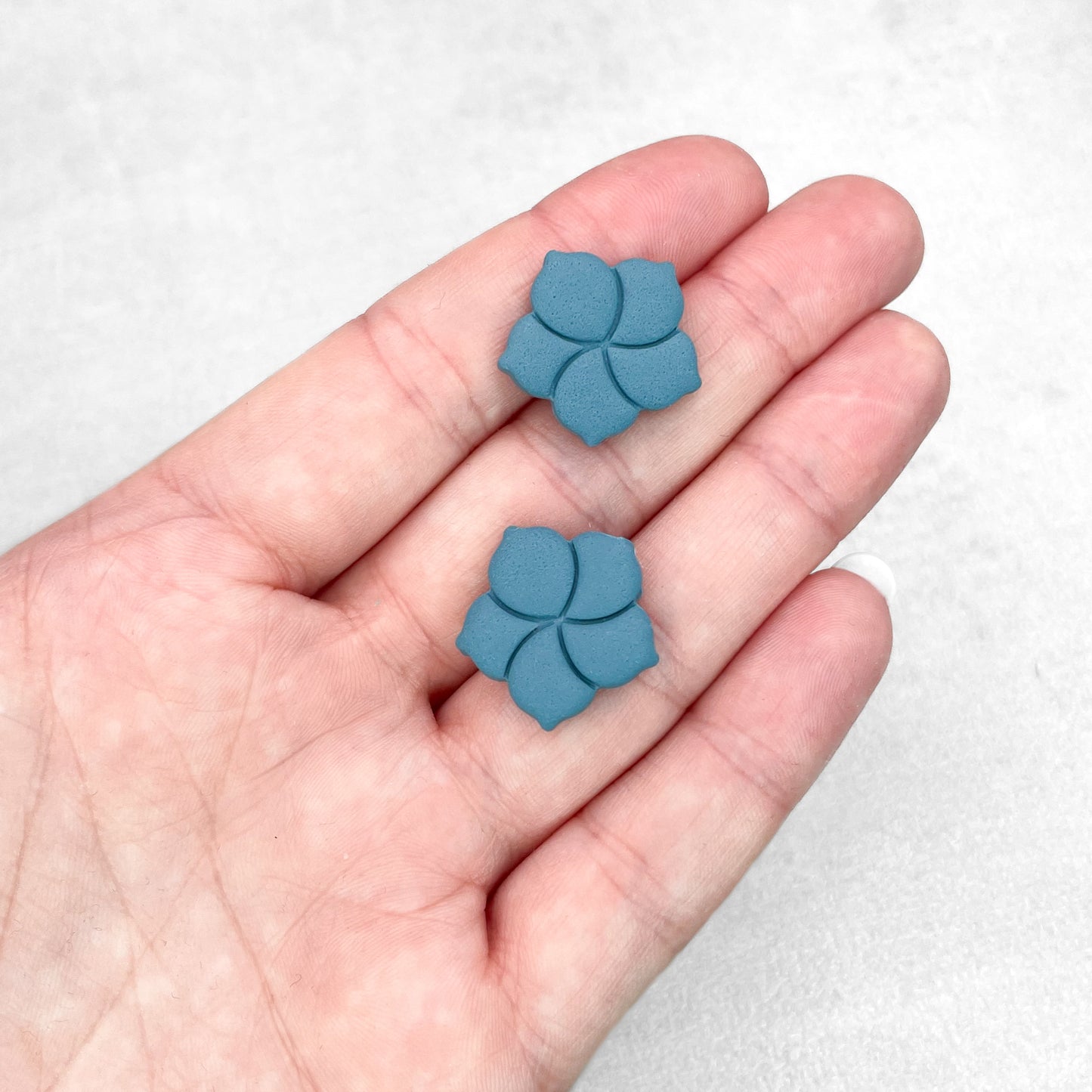 Steel blue flower stud earrings. Handmade polymer clay stud earrings.