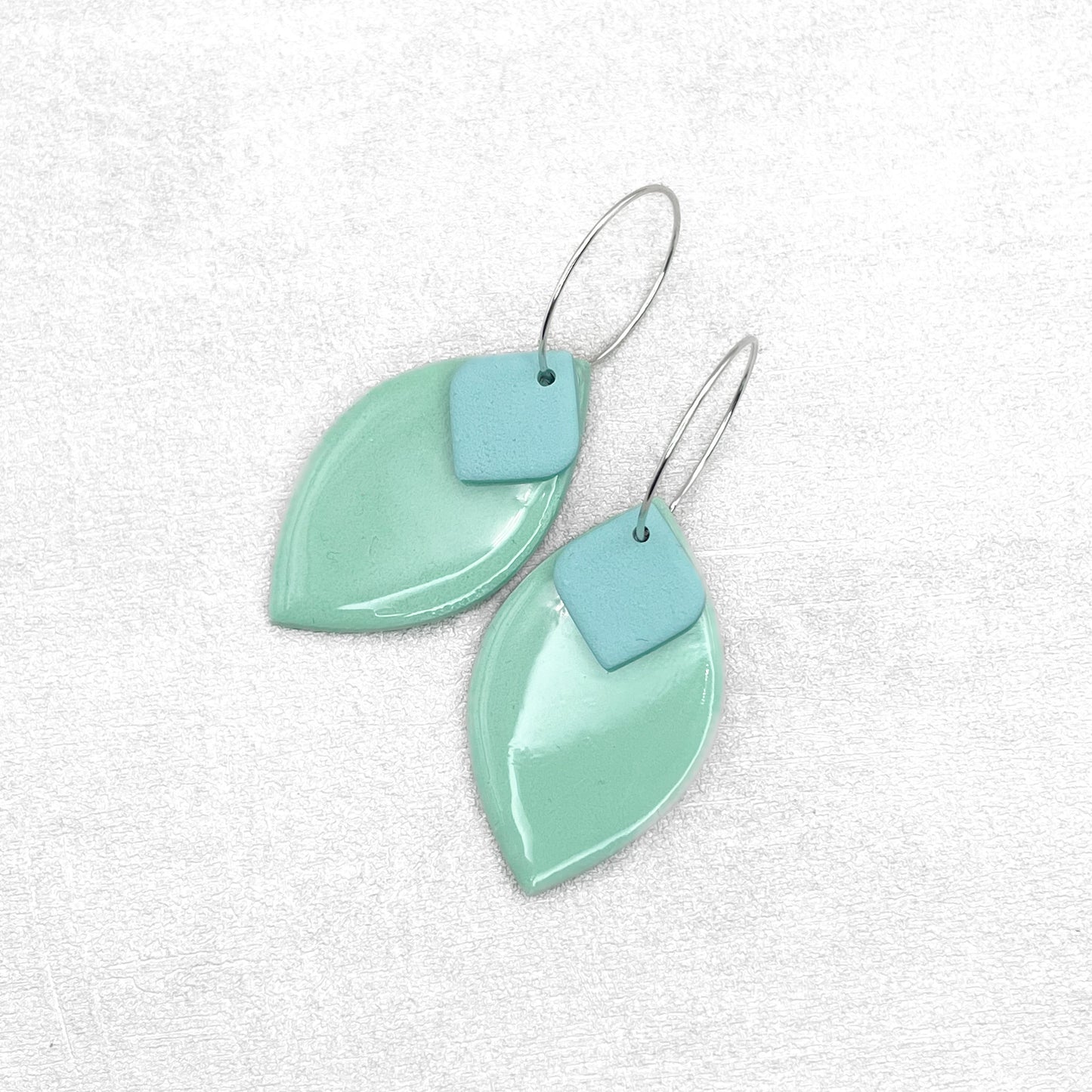 Mint oval and light blue rhombus earrings. Handmade polymer clay earrings.