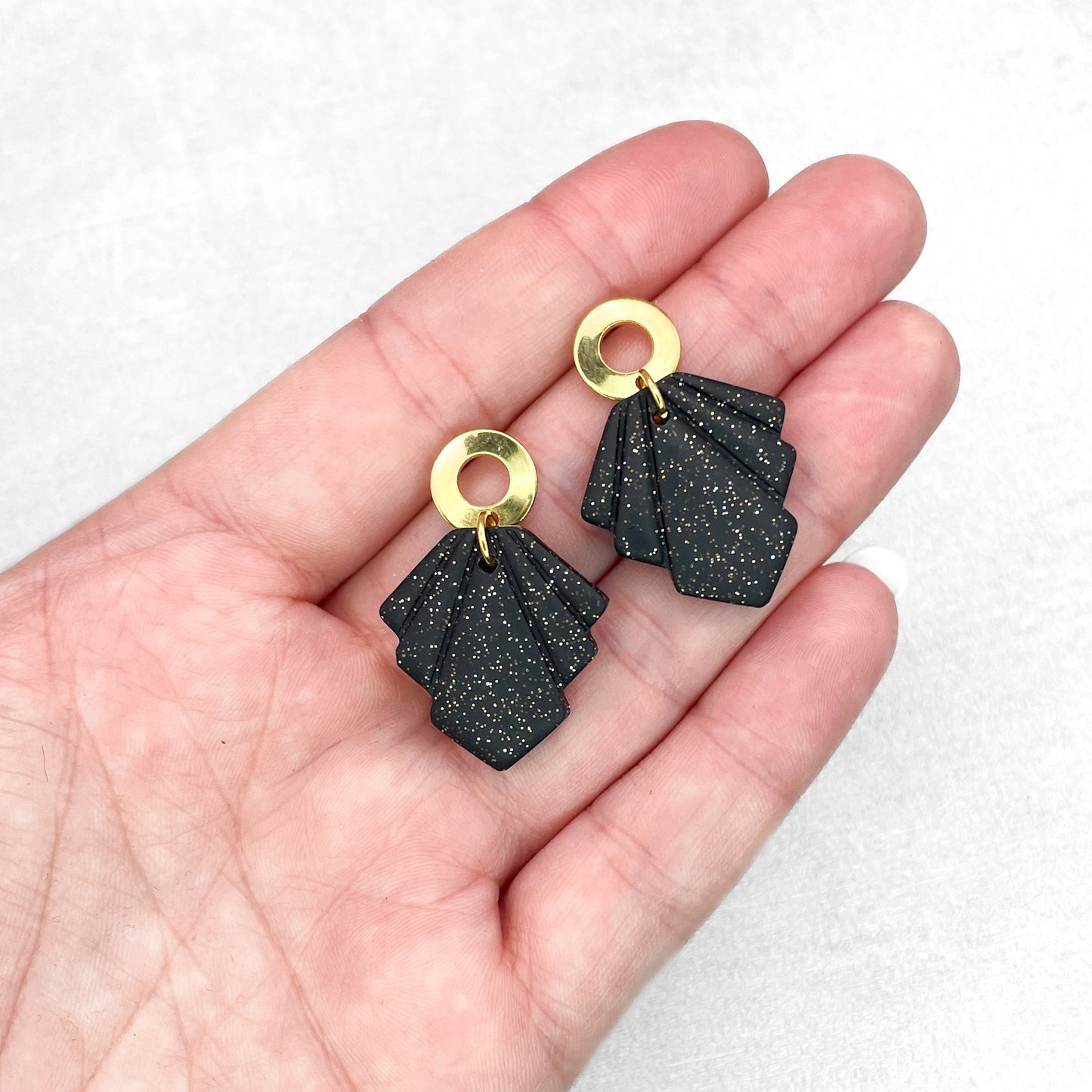 Black with gold glitter geometric earrings. Handmade polymer clay earrings.